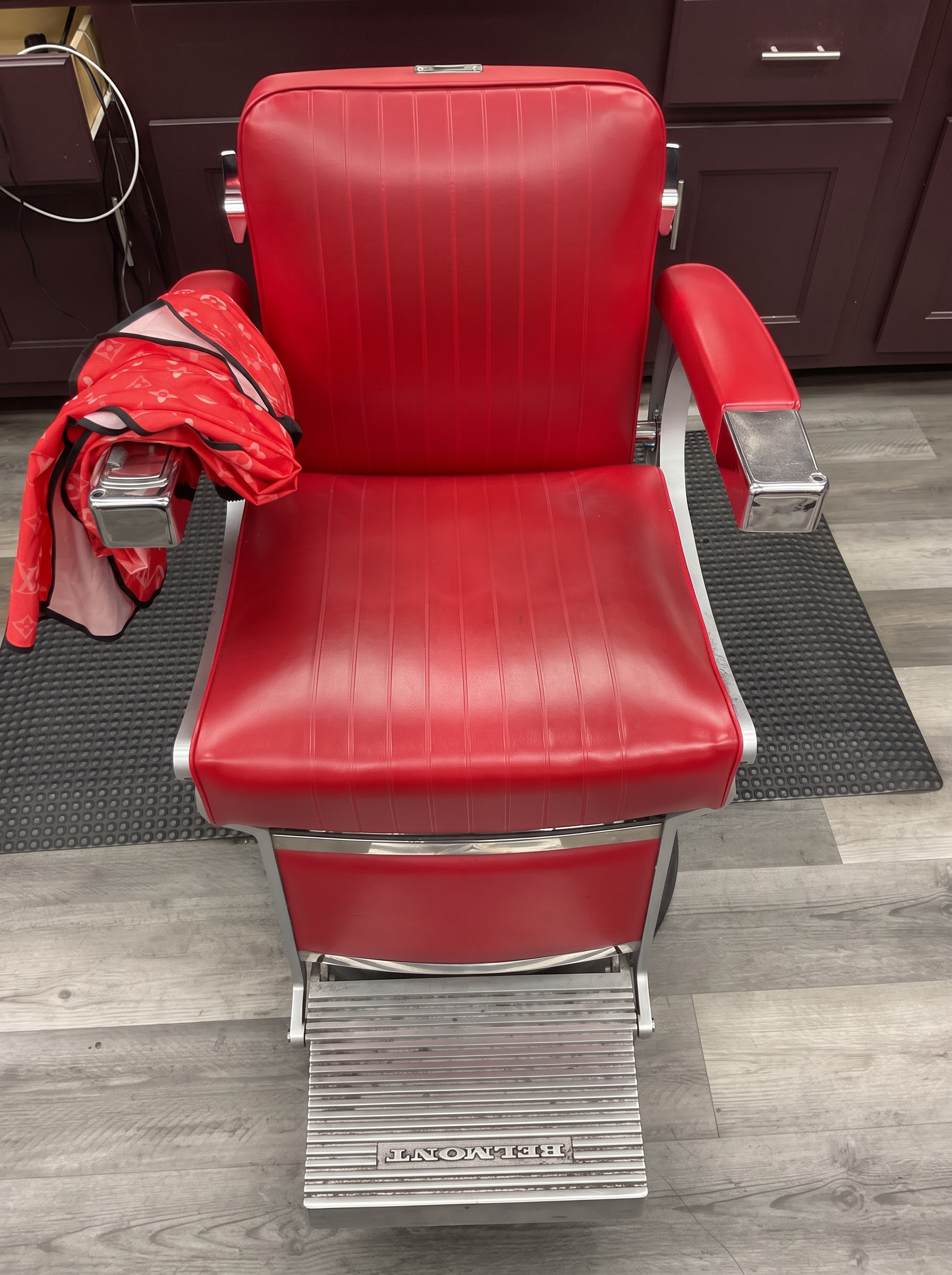 Classic red Belmont barber chair at Dapper Cuts Barbershop in Phoenix